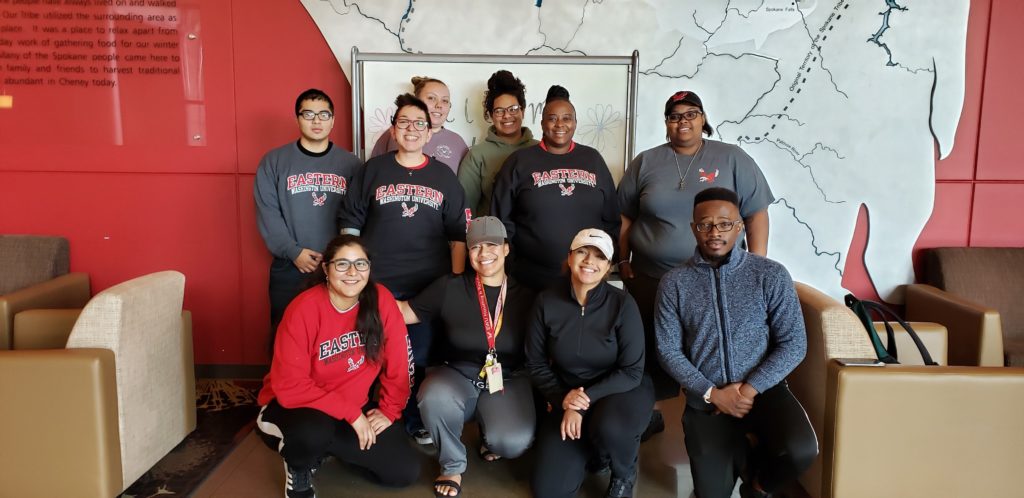 Photo of Eastern Washington University staff and students with two rows, one row standing, and one row kneeling