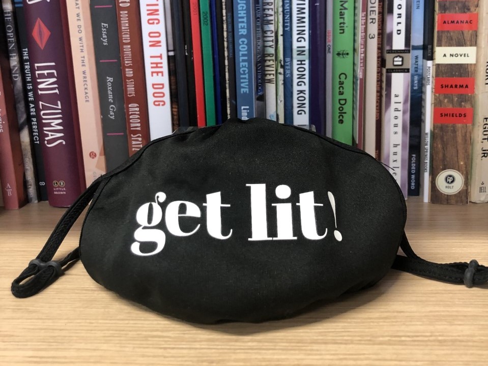 get lit! mask on a bookshelf