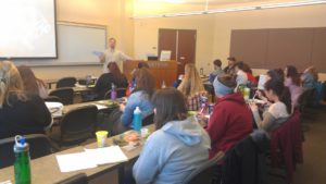 A classroom full of people listening to a discussion