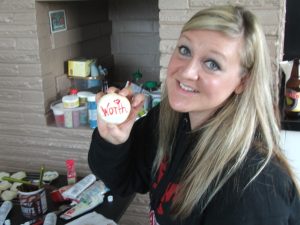 Photo of a woman holding a cookie