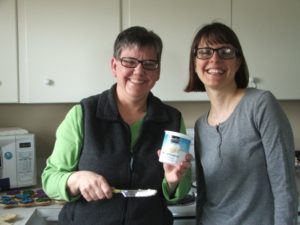 A photo of two people baking cookies
