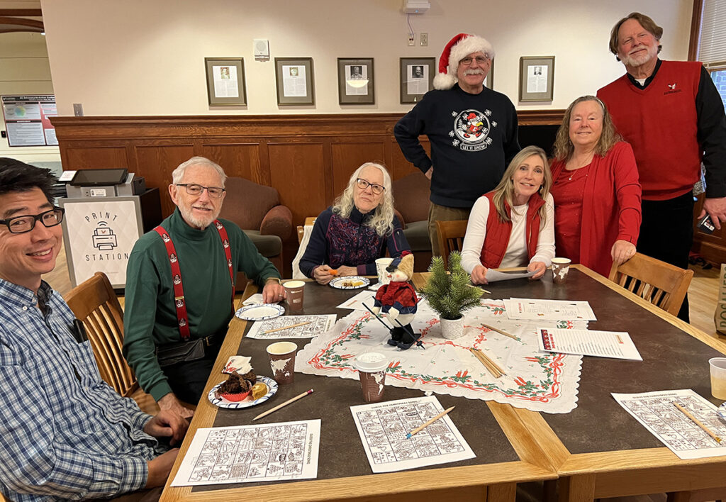 A group of retirees talking to EWU employees.