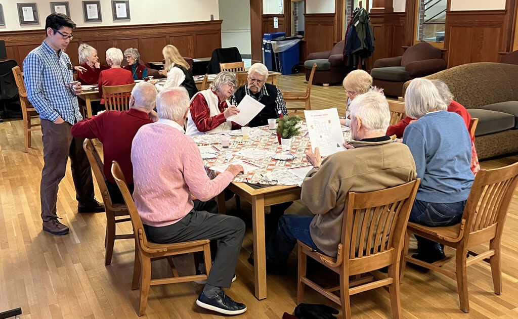 Two tables of people playing games.